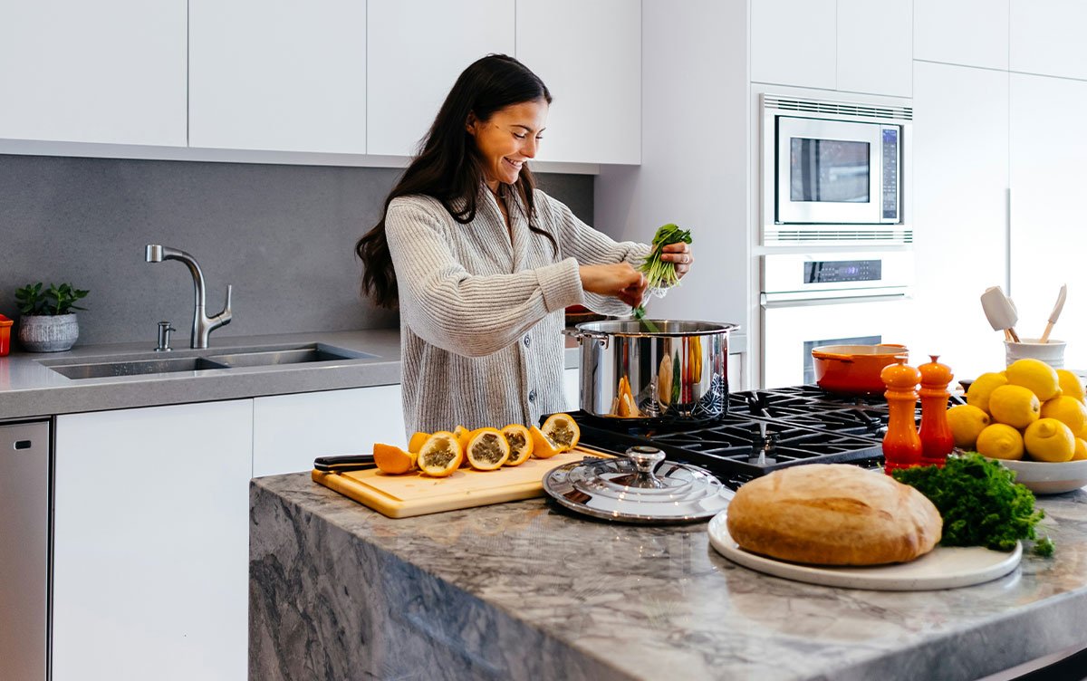 woman cooking in kitchen woman cooking in kitchen